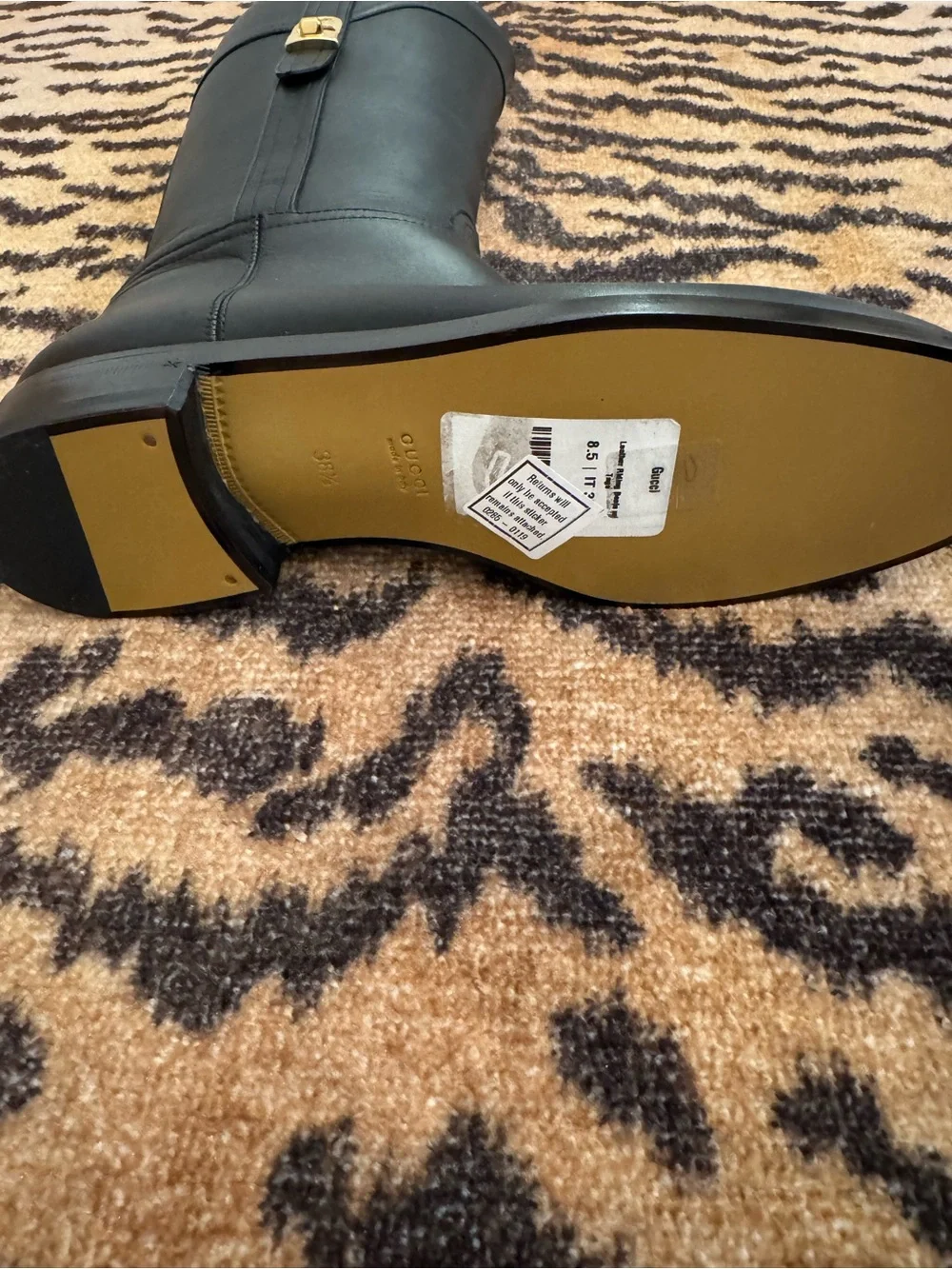 GUCCI Women’s Black Leather Knee-High Riding Boots with Gold Buckle